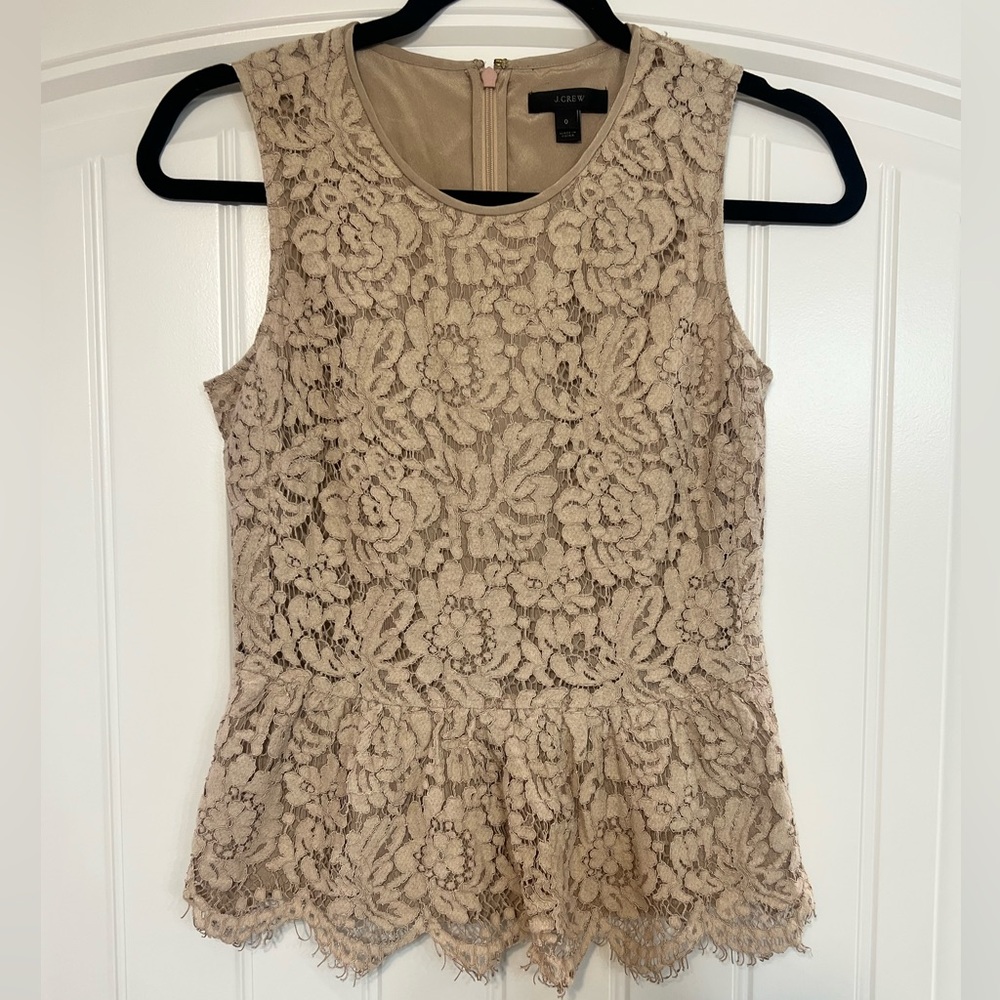 J. Crew lace peplum top zips in back with closure.